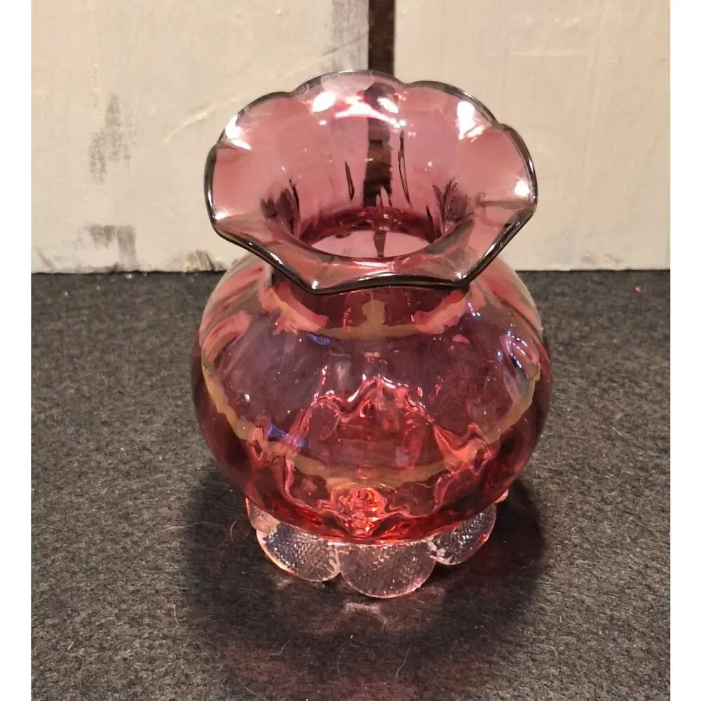 Vintage med century cranberry vase. Thumbprint base and ruffed top.